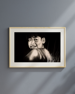 Charcoal portrait of joyful child laughing